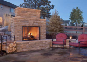 katy paver designs outdoor fireplace and chairs